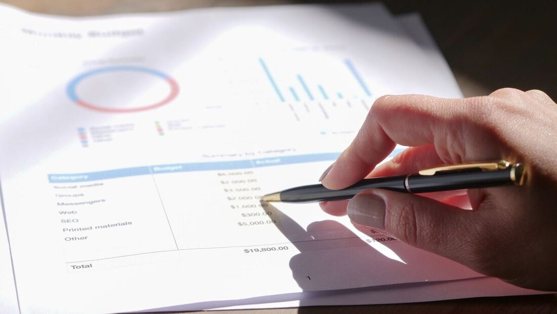Reviewing a small-business budget report with charts