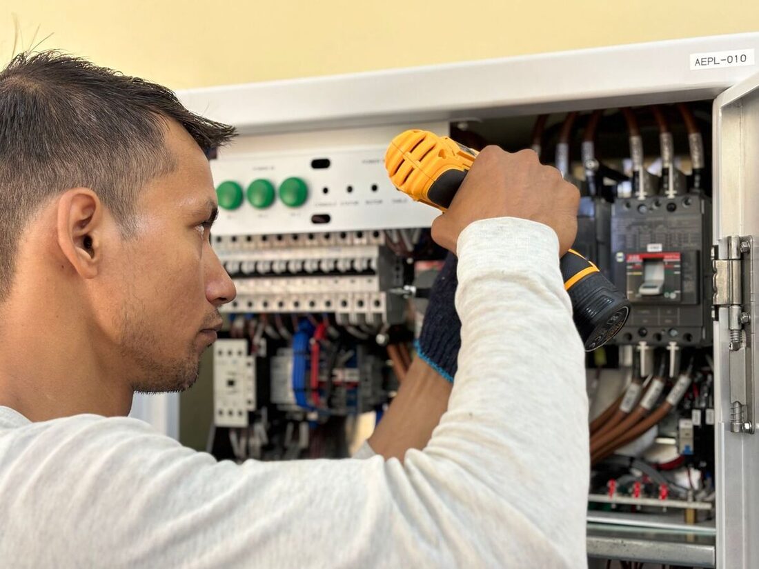 Electrician working on a residential electrical panel in Nashville