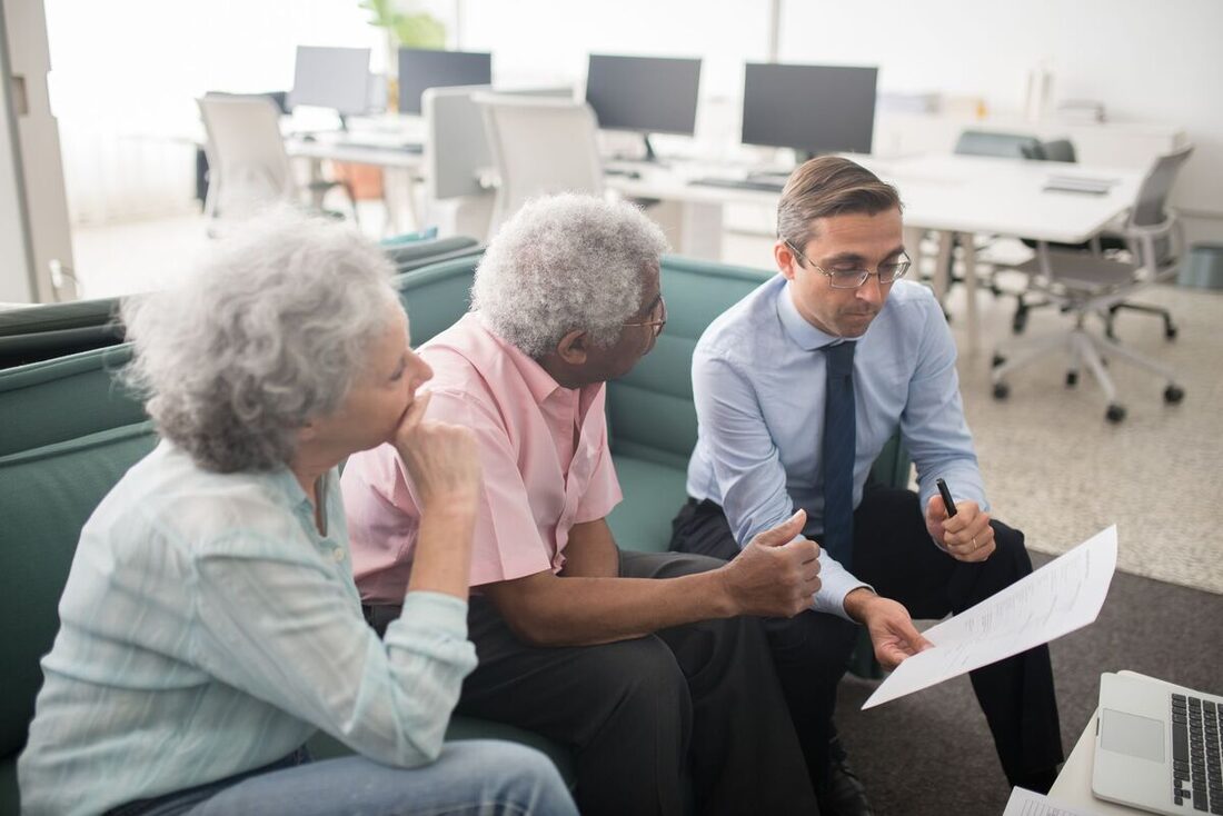 Financial advisor reviewing a plan with a couple in a Nashville office