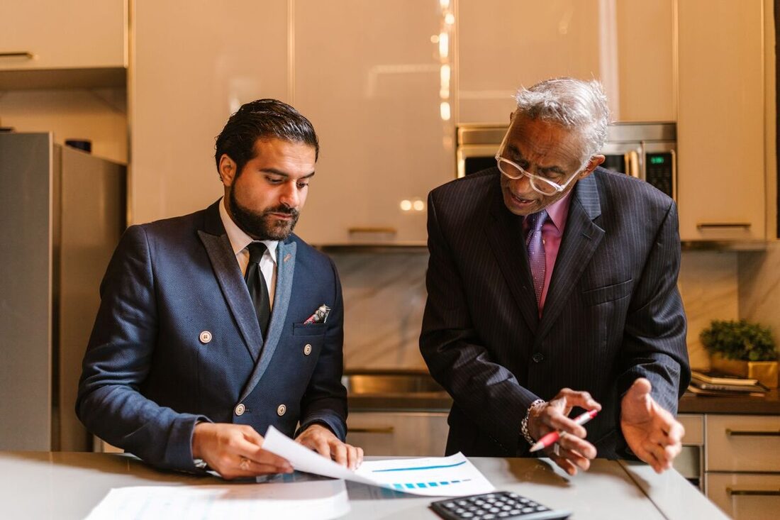 Advisors reviewing financial charts and analysis