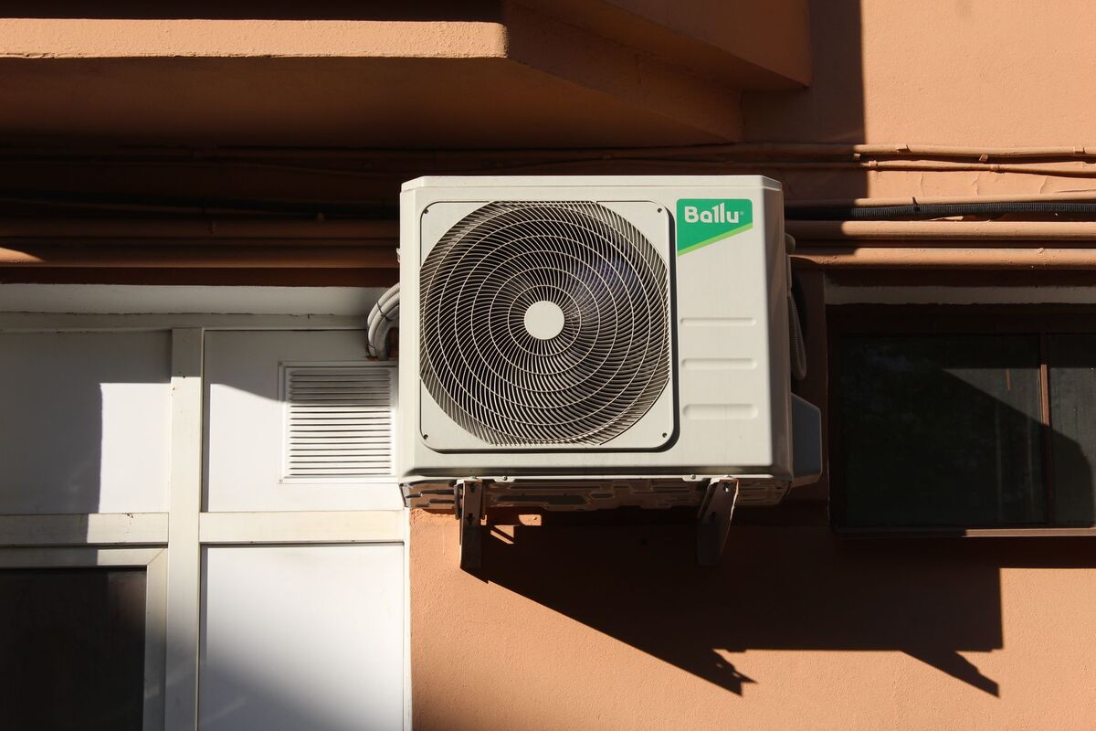 Outdoor air conditioning condenser unit on a home