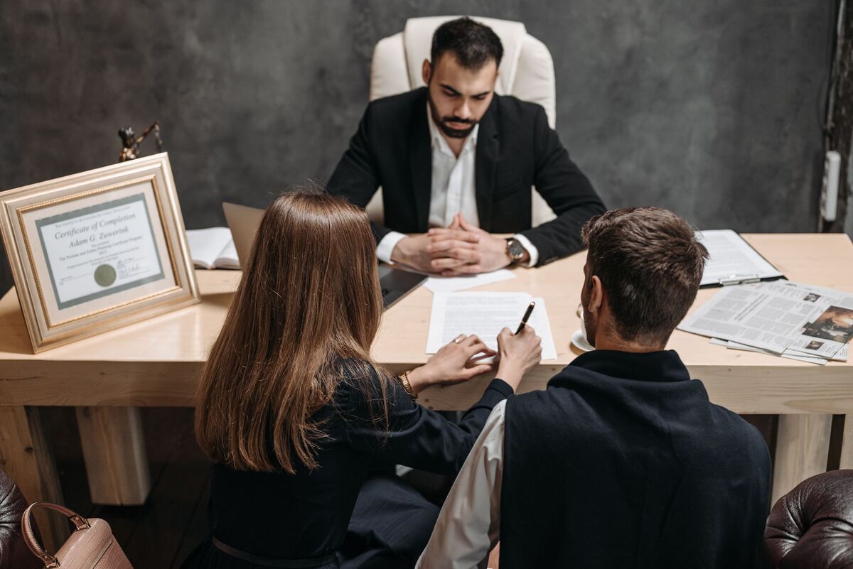 Nashville attorney meeting with clients to sign a case