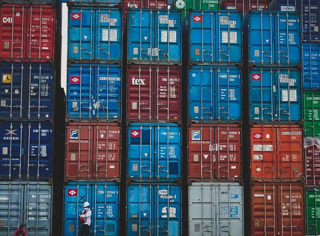 Cargo container port with stacked shipping containers