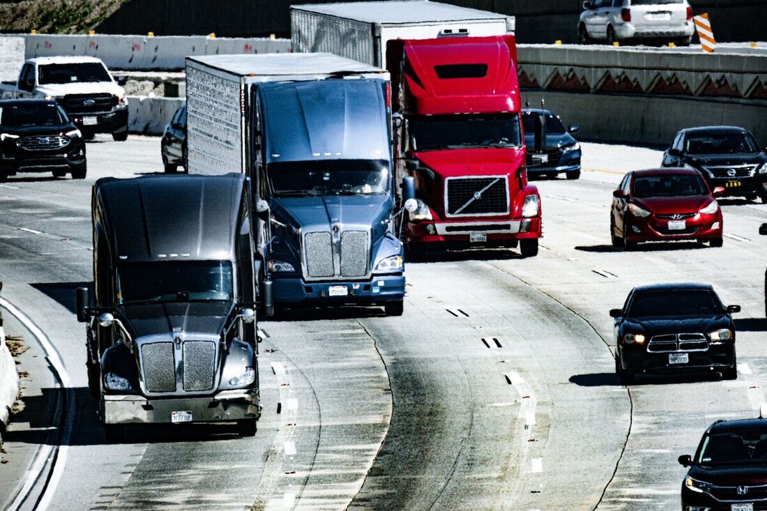 Semi-trucks on a highway in freight traffic