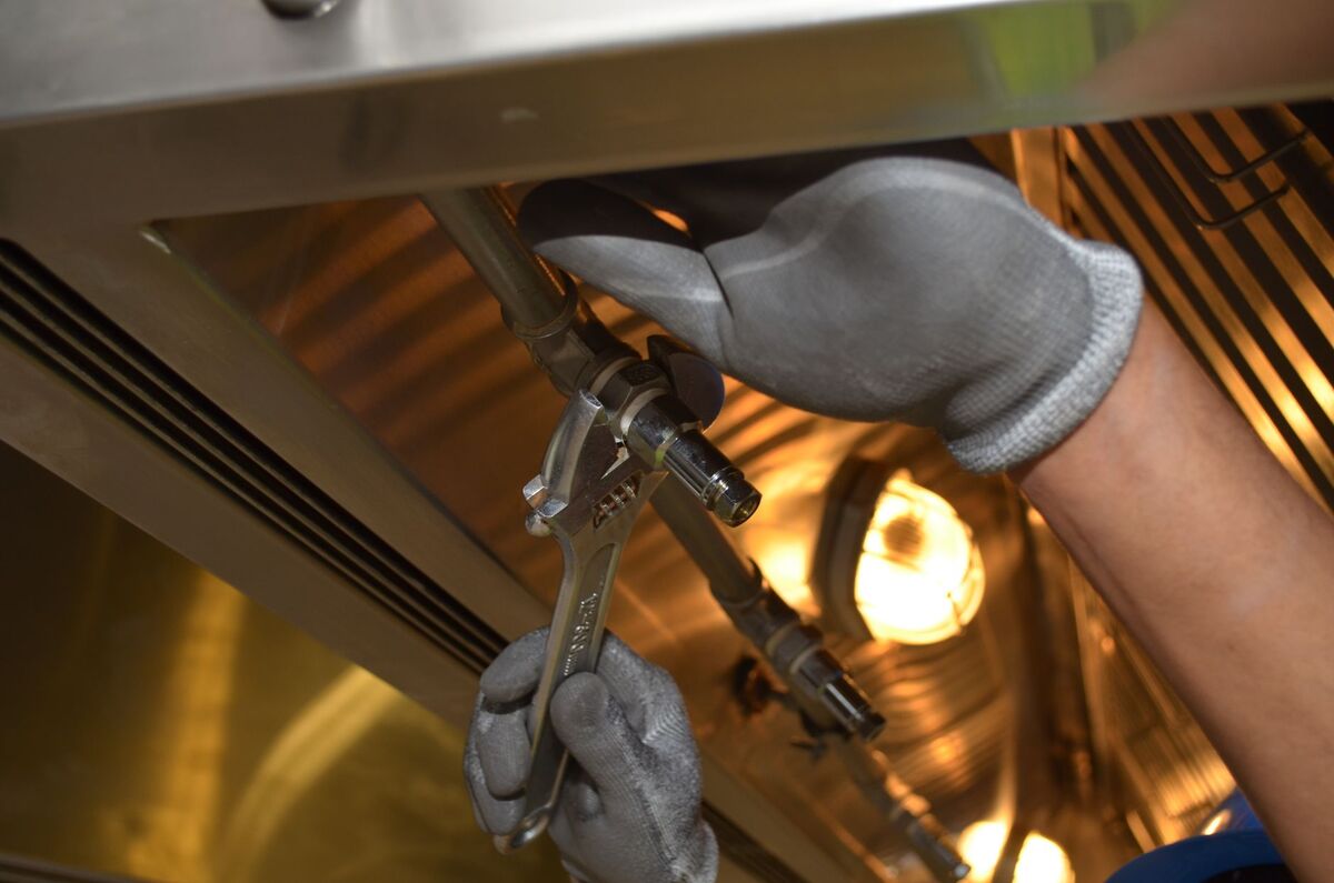 Plumber working on a pipe connection