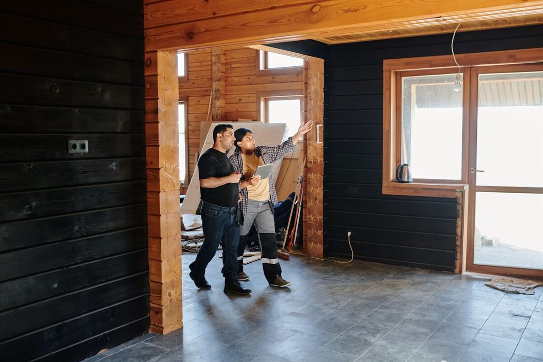 Remodeling contractors reviewing plans during a Nashville home renovation
