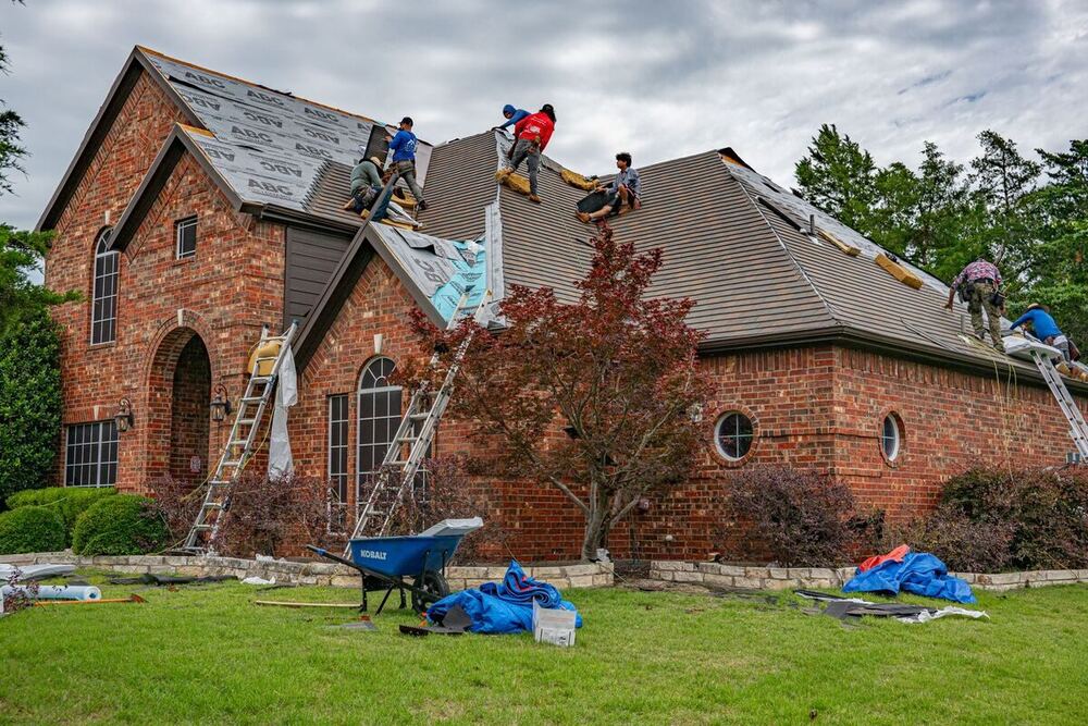 Roofing crew replacing a roof on a Nashville-area home