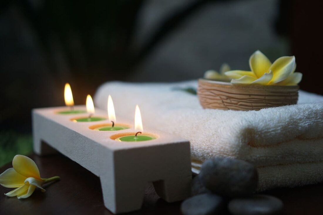 Serene Nashville day-spa setting with candles and towels